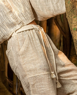 Customer wearing light colored top and pants