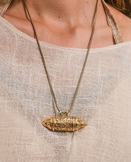 Customer wearing light colored top and pants